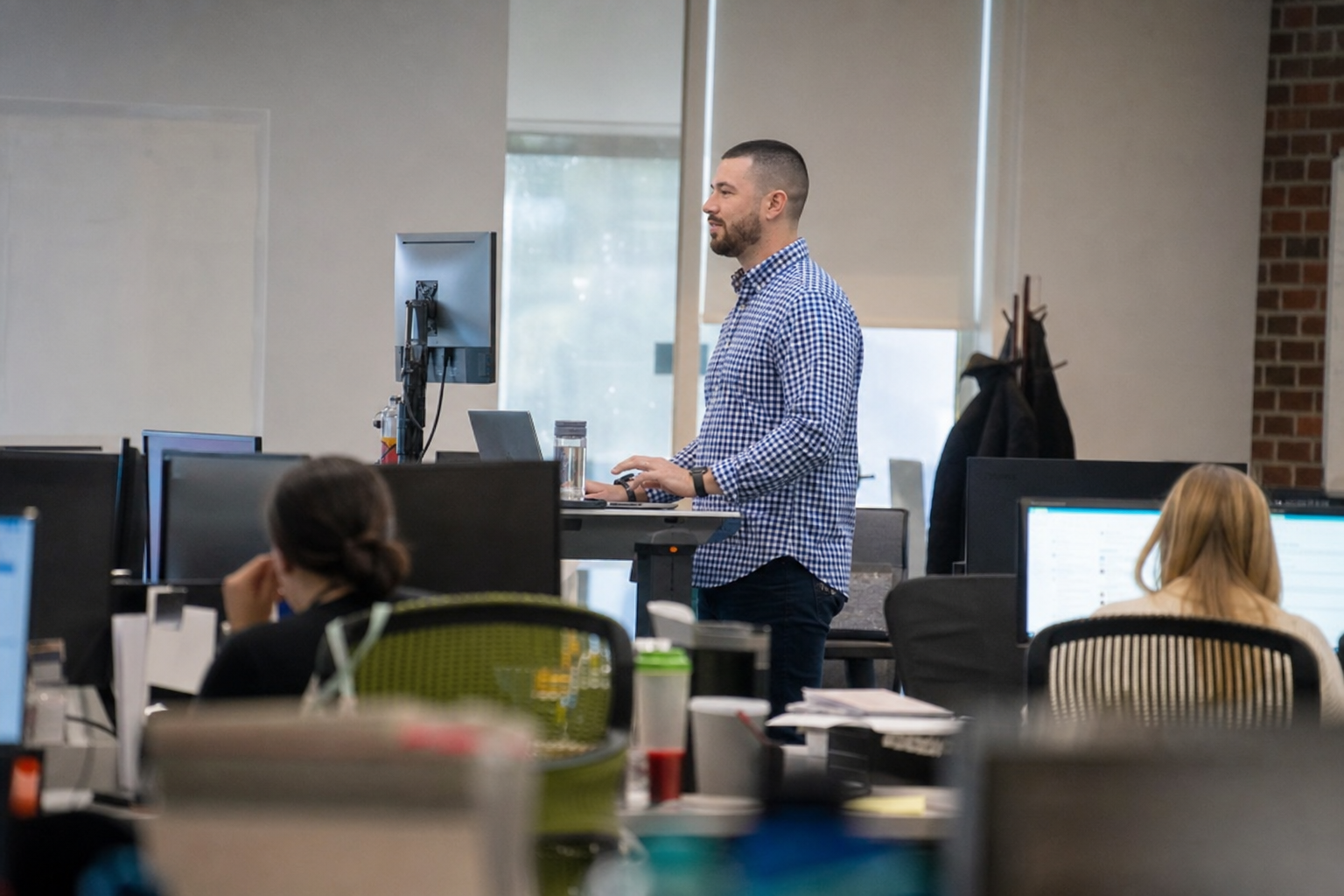 Chandler Drake Talley photo: afar side view at a standing desk Chandler Drake Talley, Senior AI Engineer — afar side view at a standing desk