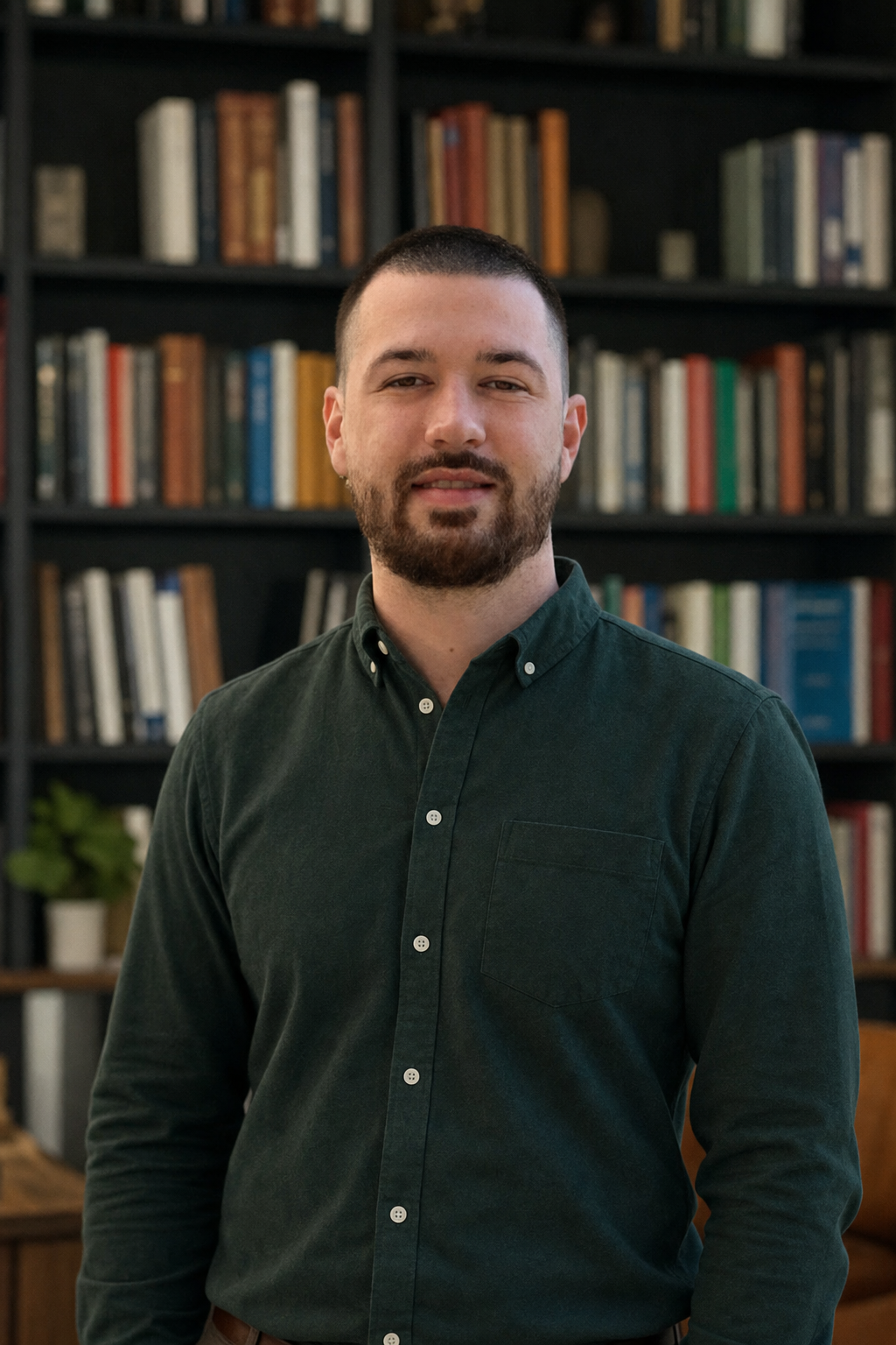Chandler Drake Talley photo: office portrait beside a bookshelf Chandler Drake Talley, Senior AI Engineer — office portrait beside a bookshelf