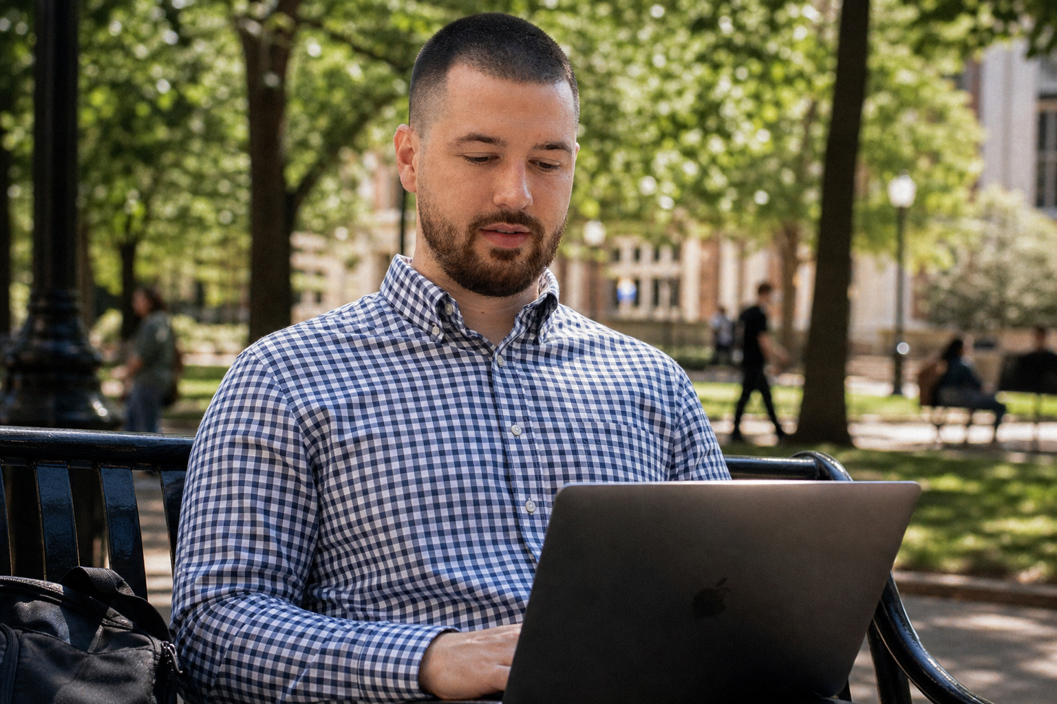 Chandler Drake Talley photo: working on a laptop on a campus bench Chandler Drake Talley, Senior AI Engineer — working on a laptop on a campus bench