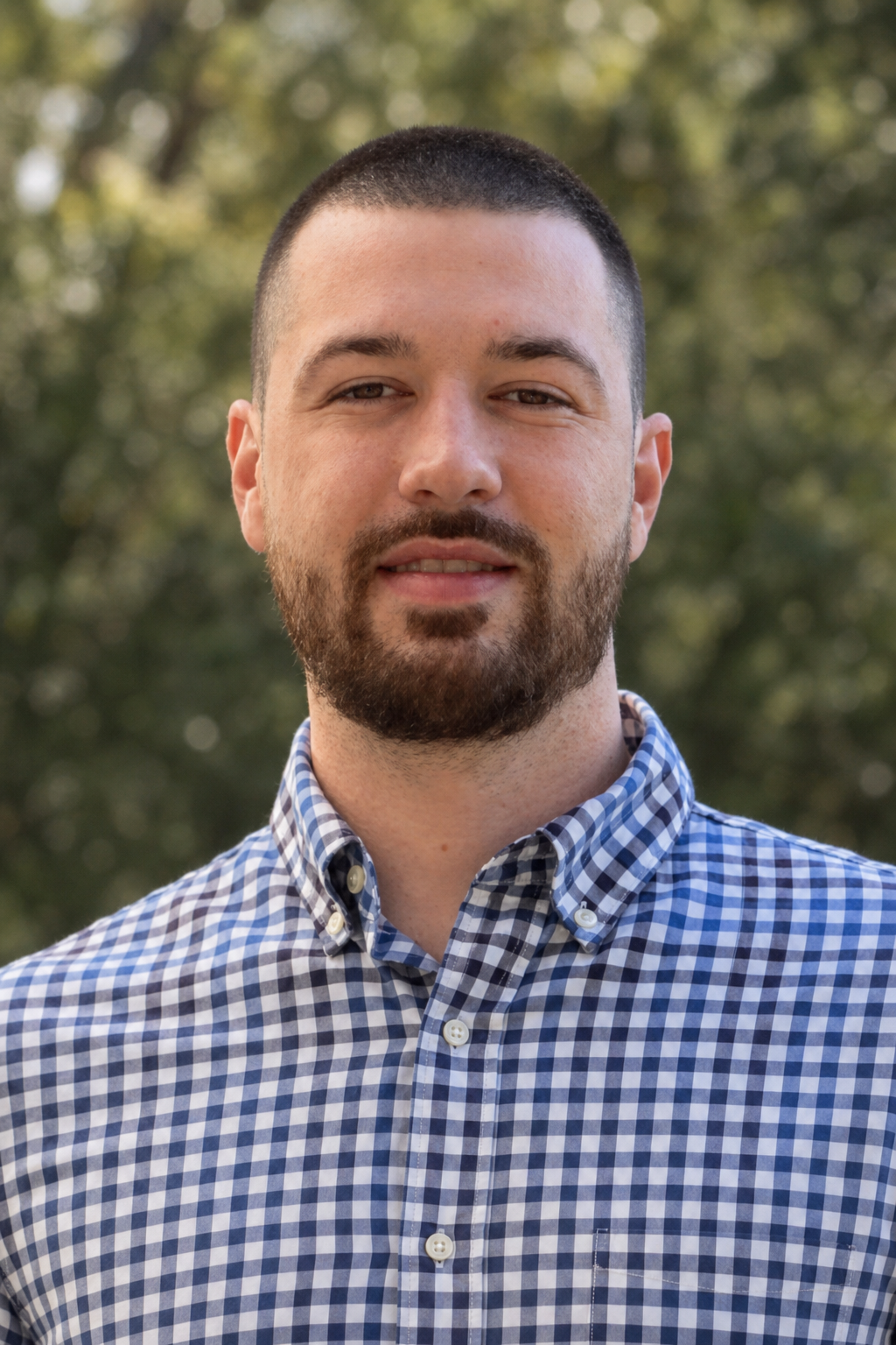 Chandler Drake Talley photo: outdoor headshot in a gingham shirt Chandler Drake Talley, Senior AI Engineer — outdoor headshot in a gingham shirt