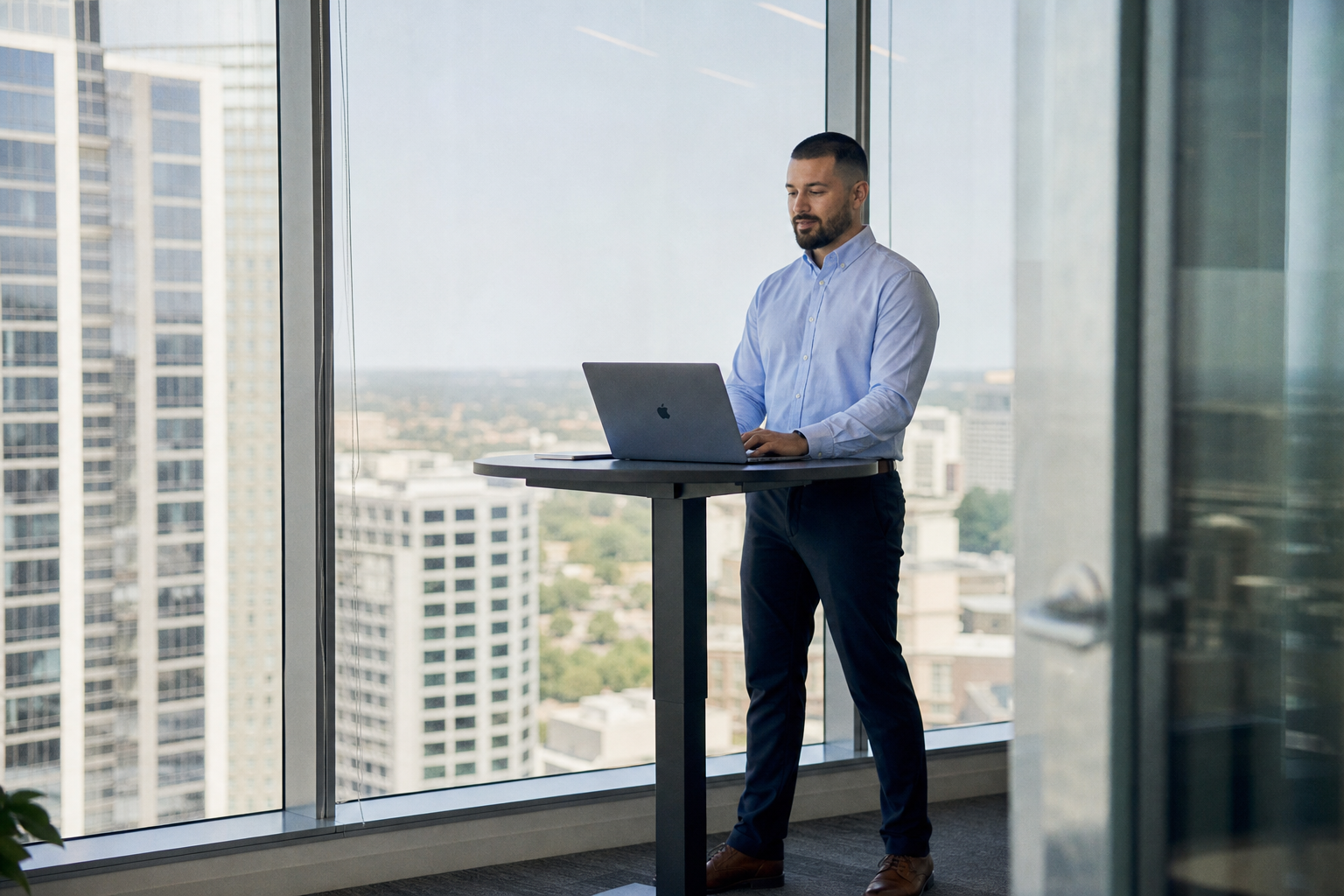 Chandler Drake Talley photo: standing in a glass-walled office Chandler Drake Talley, Senior AI Engineer — standing in a glass-walled office