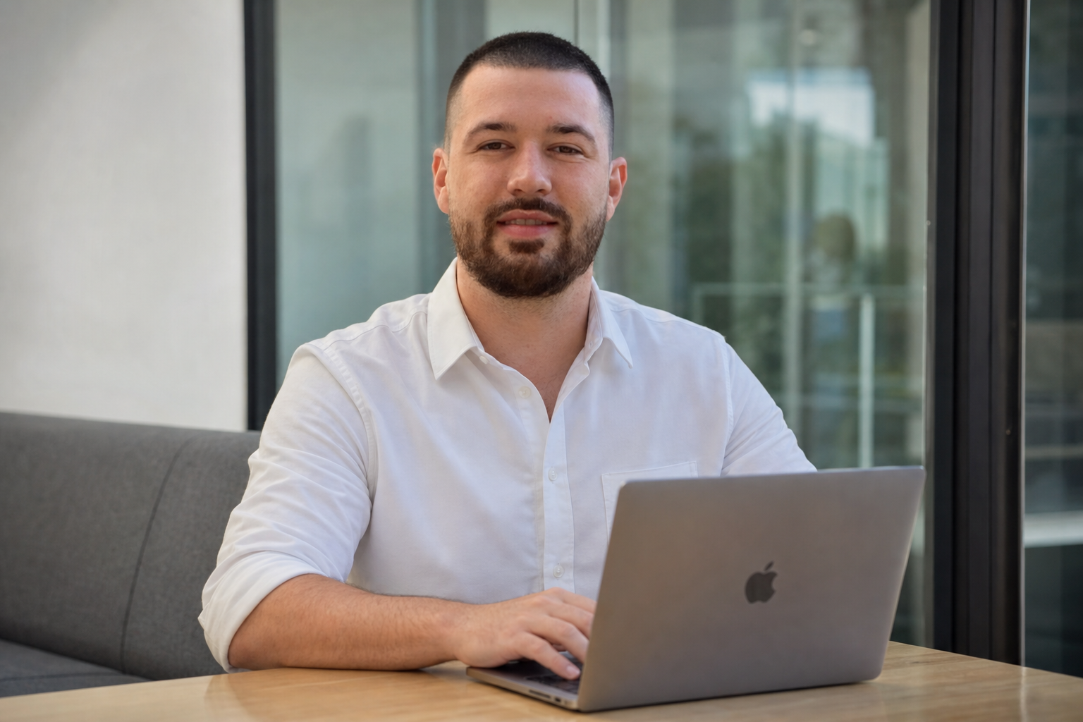 Chandler Drake Talley photo: typing on a laptop in a huddle room Chandler Drake Talley, Senior AI Engineer — typing on a laptop in a huddle room
