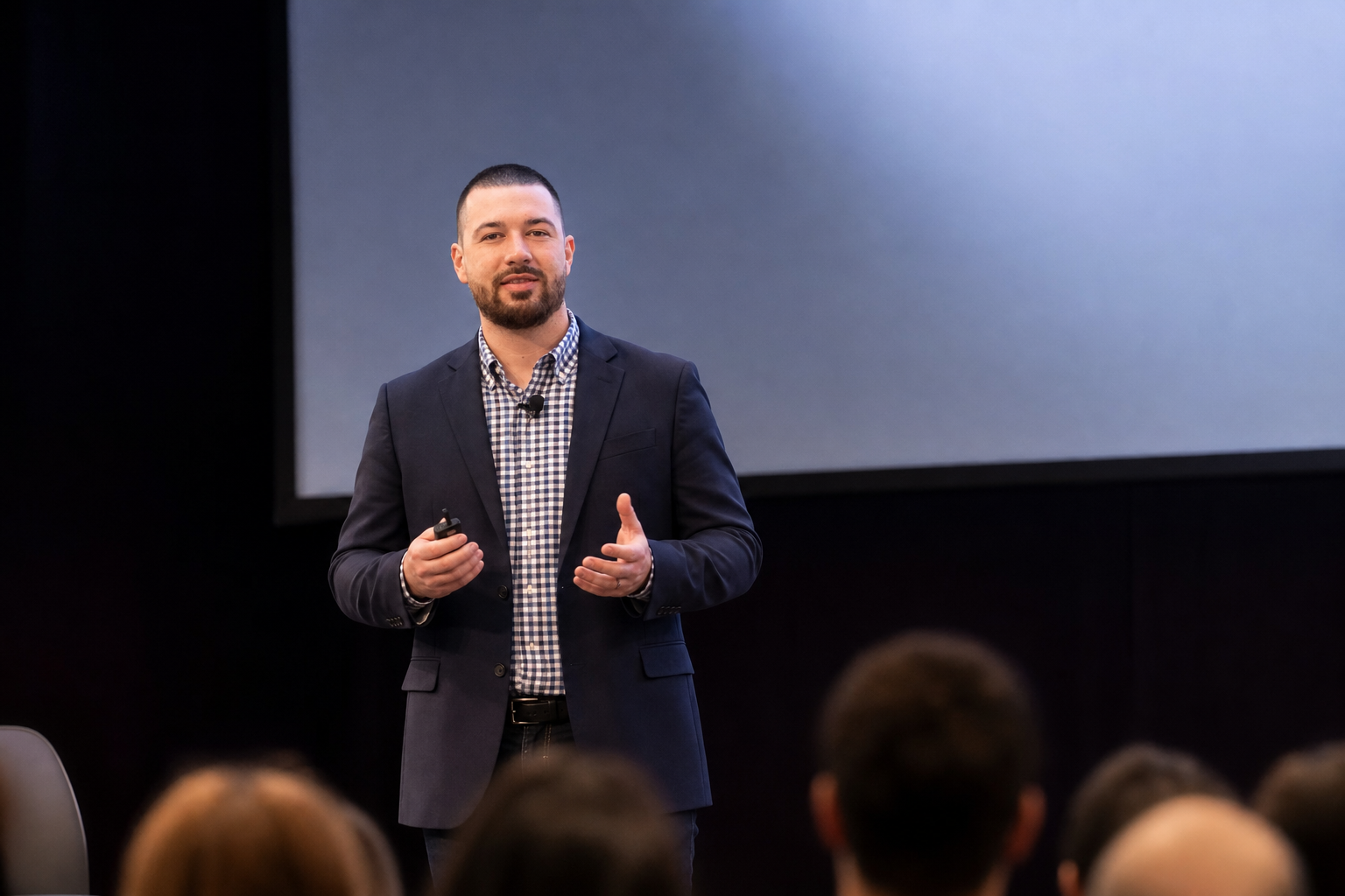 Chandler Drake Talley photo: delivering a keynote on stage Chandler Drake Talley, Senior AI Engineer — delivering a keynote on stage