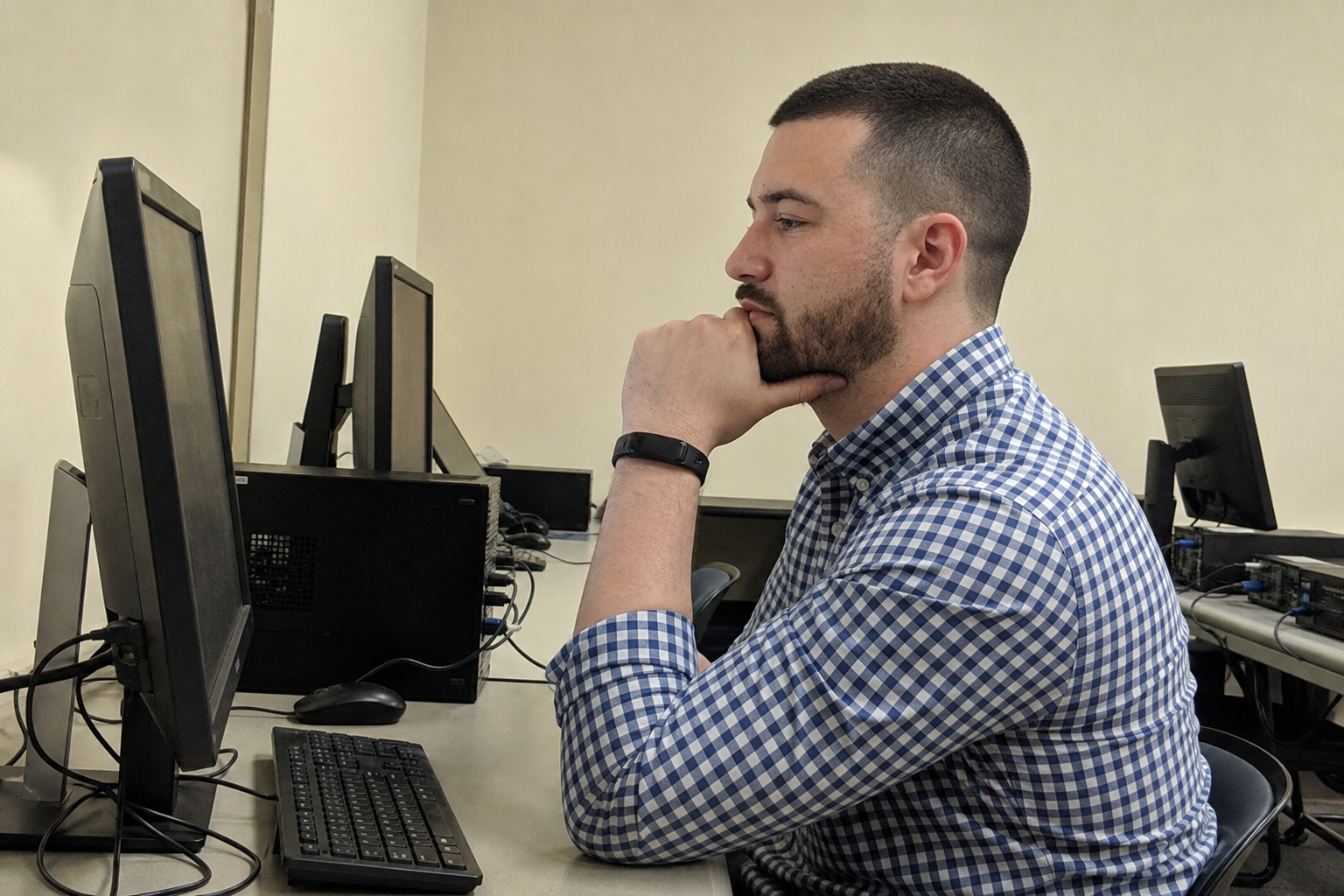 Chandler Drake Talley photo: side candid in a computer lab Chandler Drake Talley, Senior AI Engineer — side candid in a computer lab