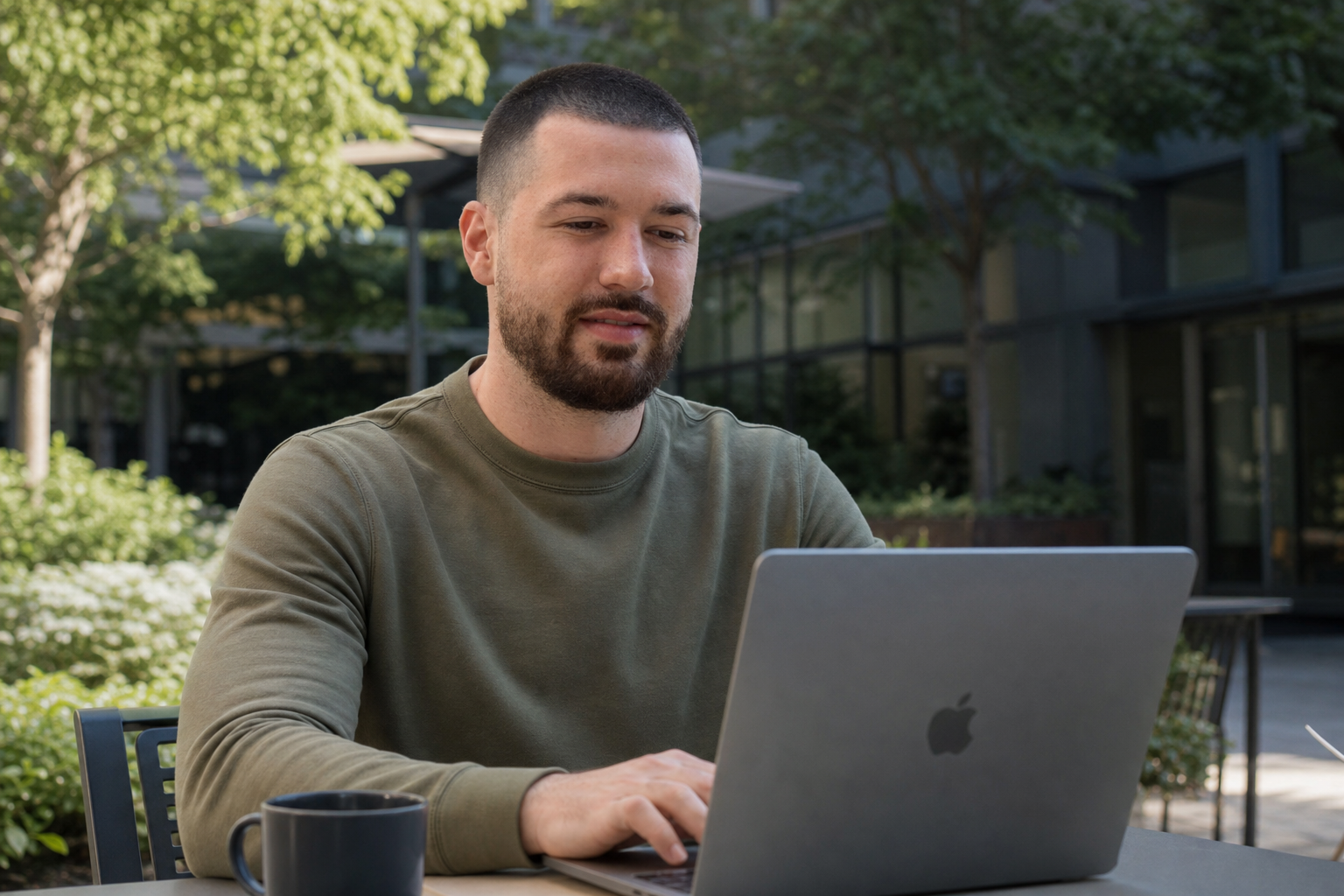 Chandler Drake Talley photo: working on a laptop in a garden courtyard Chandler Drake Talley, Senior AI Engineer — working on a laptop in a garden courtyard