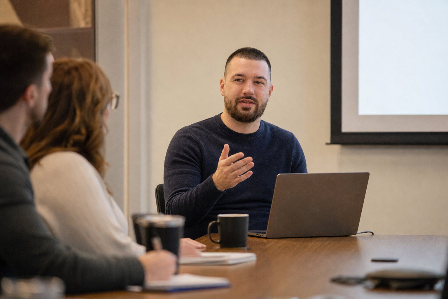 Chandler Drake Talley photo: leading a lunch-and-learn presentation Chandler Drake Talley, Senior AI Engineer — leading a lunch-and-learn presentation