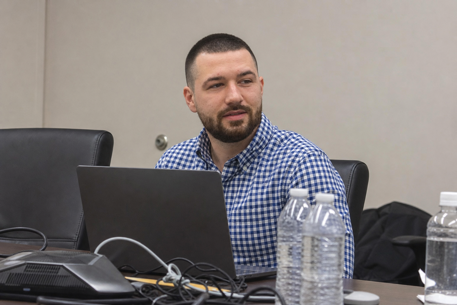 Chandler Drake Talley photo: side candid in a meeting room with a laptop Chandler Drake Talley, Senior AI Engineer — side candid in a meeting room with a laptop
