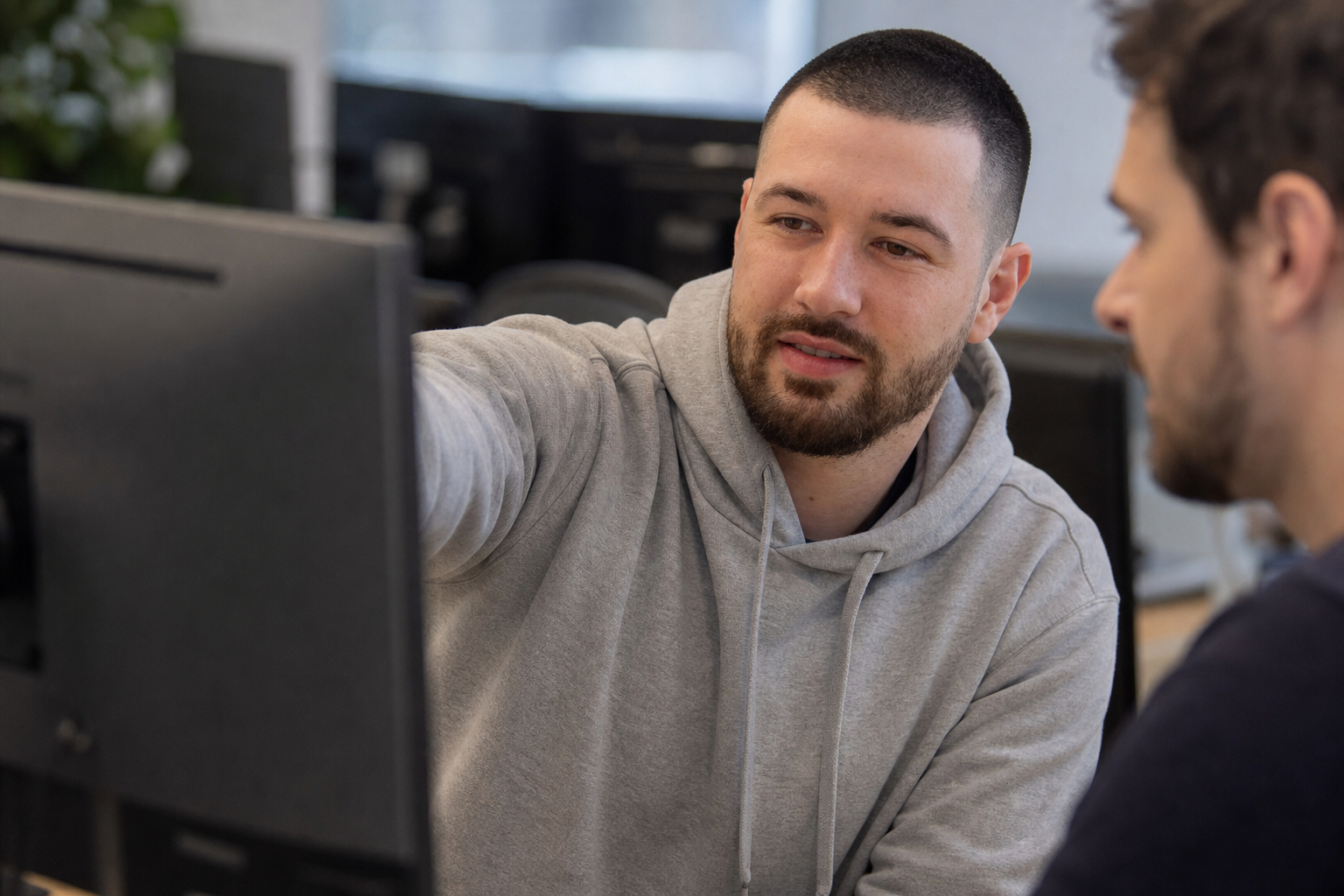 Chandler Drake Talley photo: pair programming at a computer Chandler Drake Talley, Senior AI Engineer — pair programming at a computer