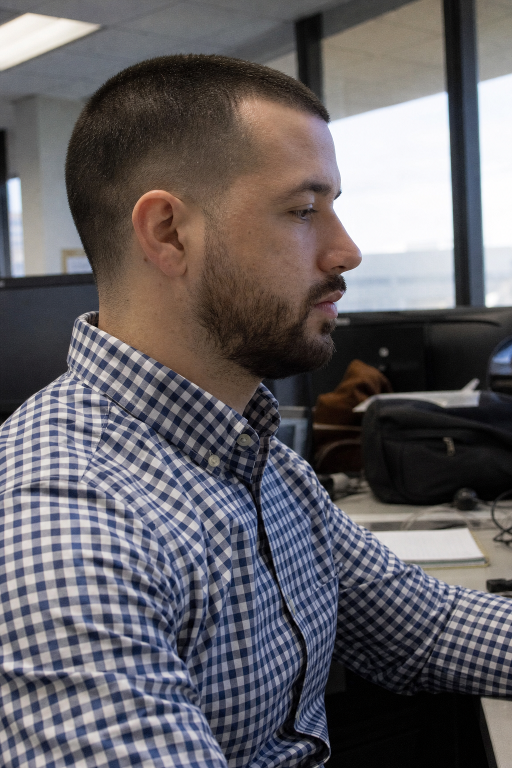 Chandler Drake Talley photo: side profile at a desk with a laptop Chandler Drake Talley, Senior AI Engineer — side profile at a desk with a laptop