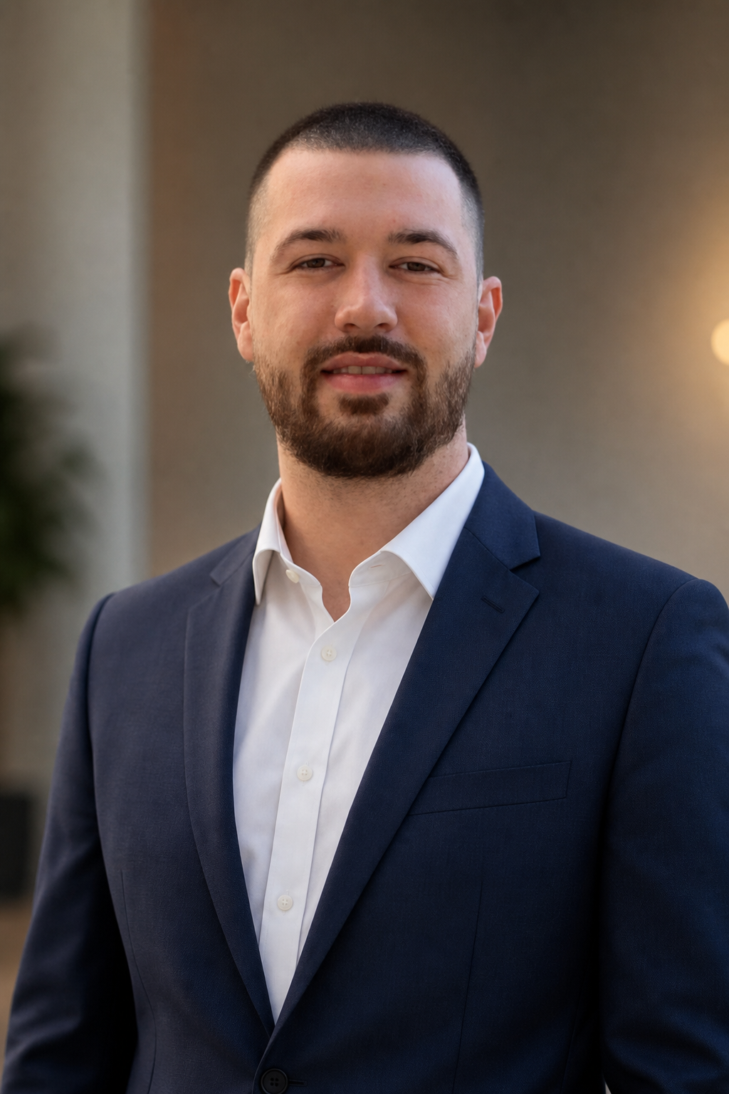 Chandler Drake Talley photo: professional portrait in a tailored suit Chandler Drake Talley, Senior AI Engineer — professional portrait in a tailored suit