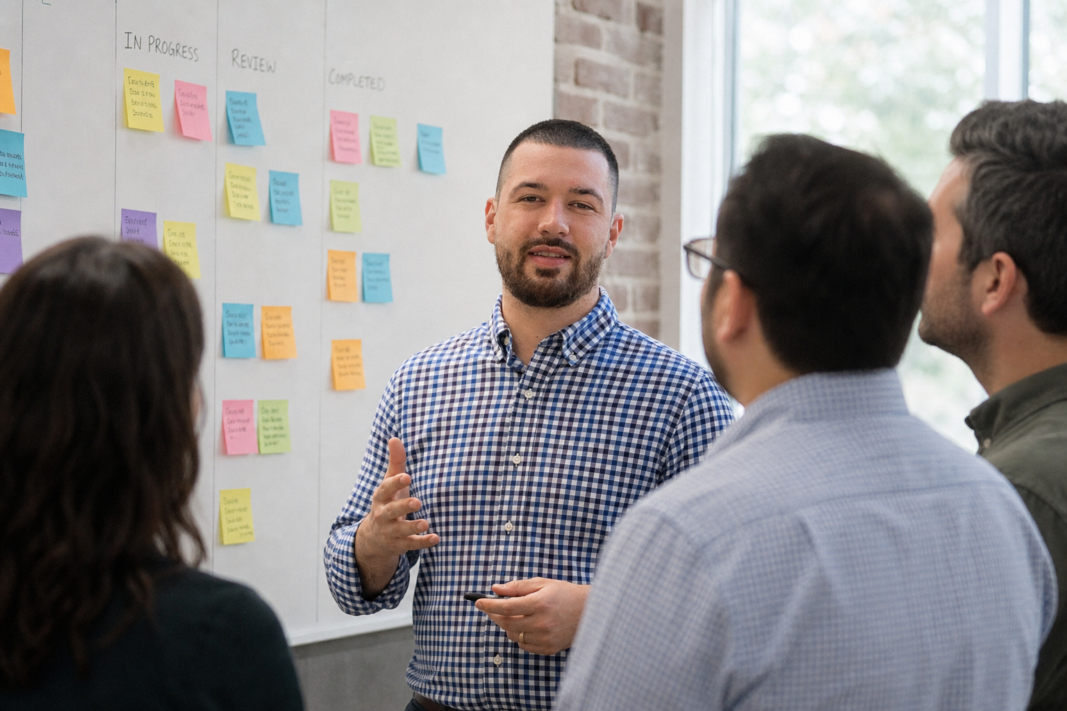 Chandler Drake Talley photo: in a team standup Chandler Drake Talley, Senior AI Engineer — in a team standup