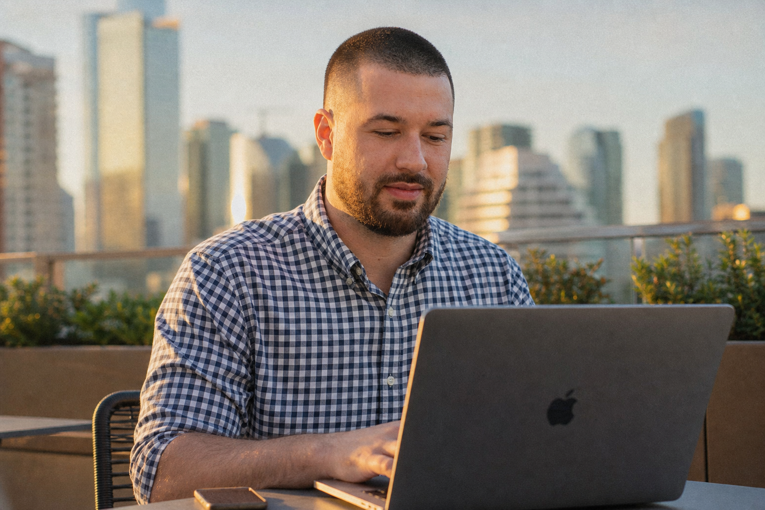 Chandler Drake Talley photo: working on a laptop on an office terrace Chandler Drake Talley, Senior AI Engineer — working on a laptop on an office terrace